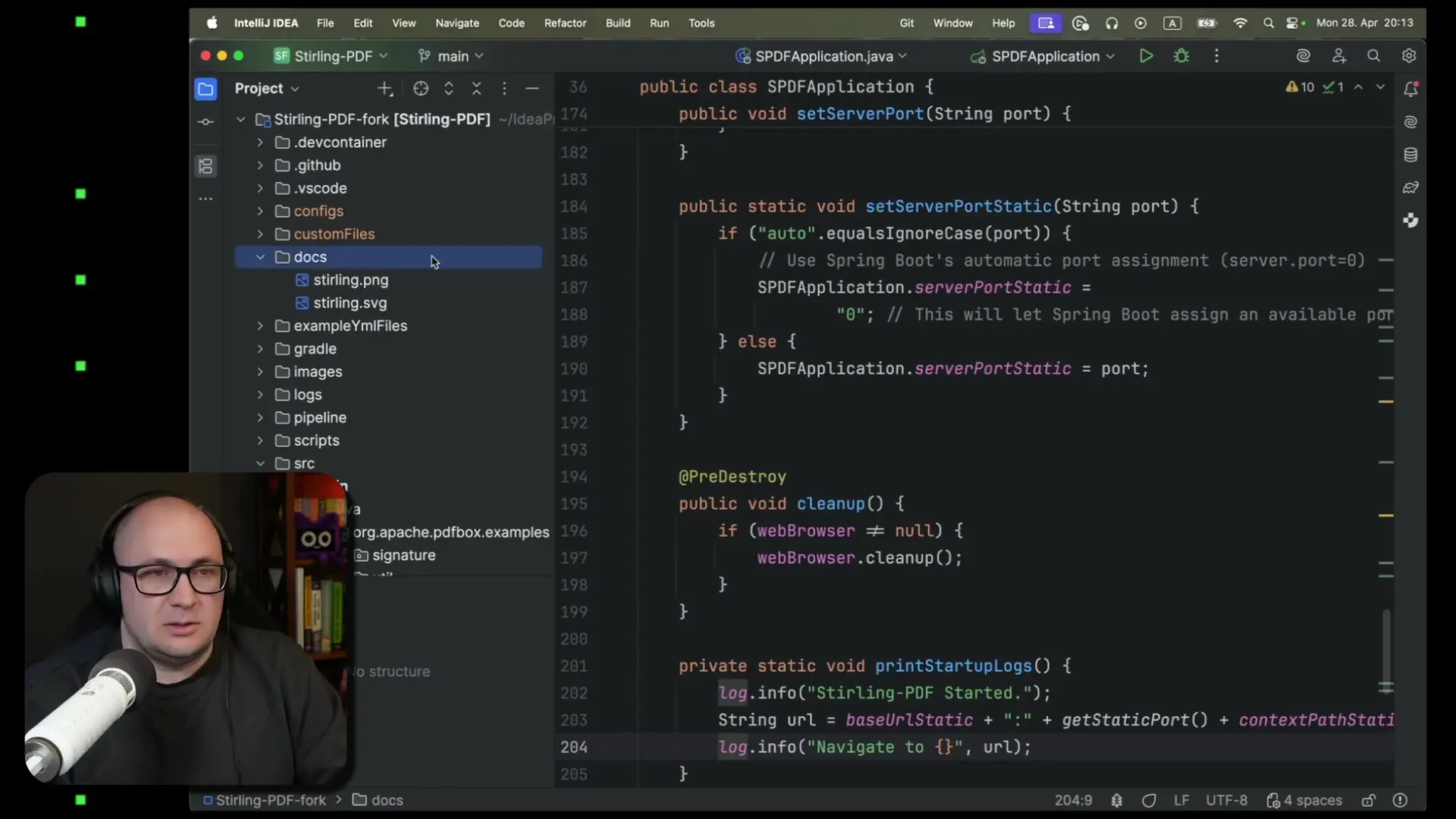 Navigating through the Stirling-PDF application code in the IDE, examining the structure and server configuration